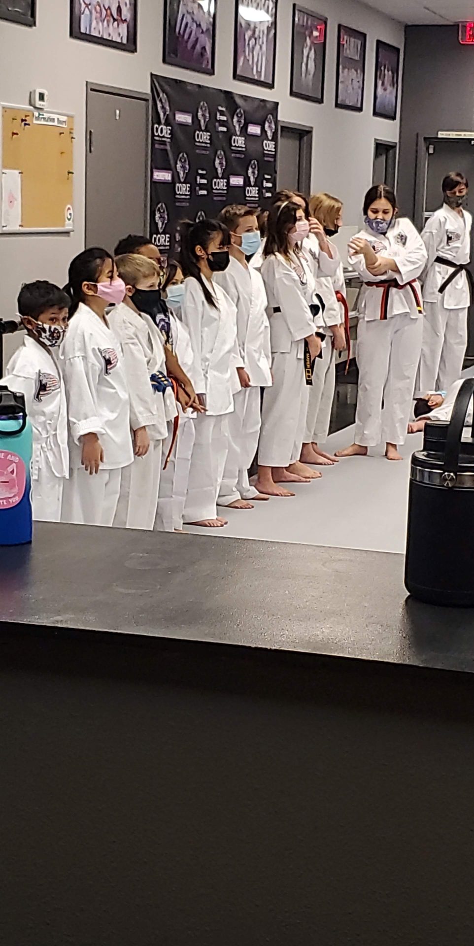 Wolf Pups students lined up in their white uniforms at CORE Fitness & Martial Arts in Henderson
