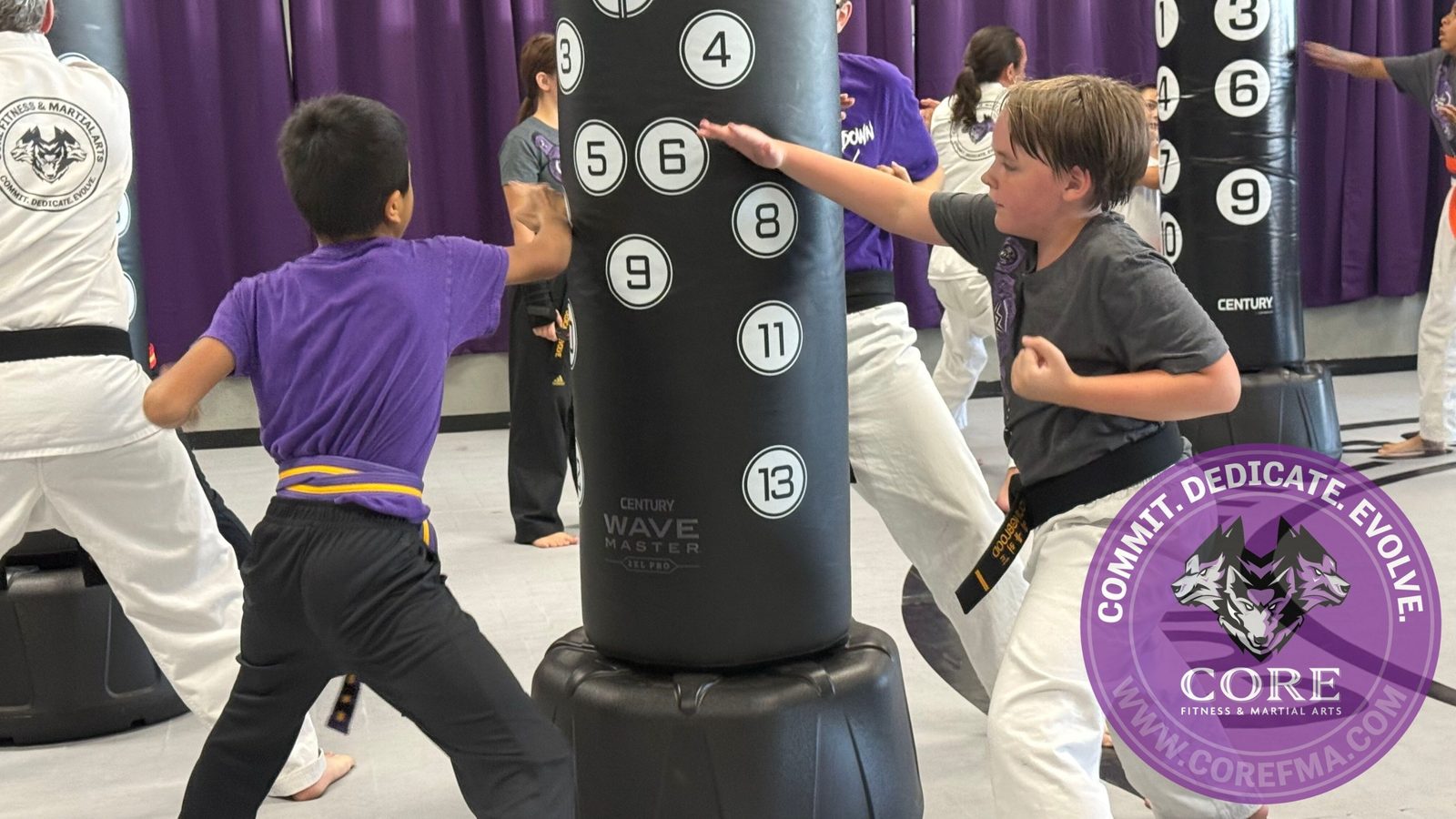 Young students practicing strikes on the heavy bags at CORE Fitness & Martial Arts in Henderson