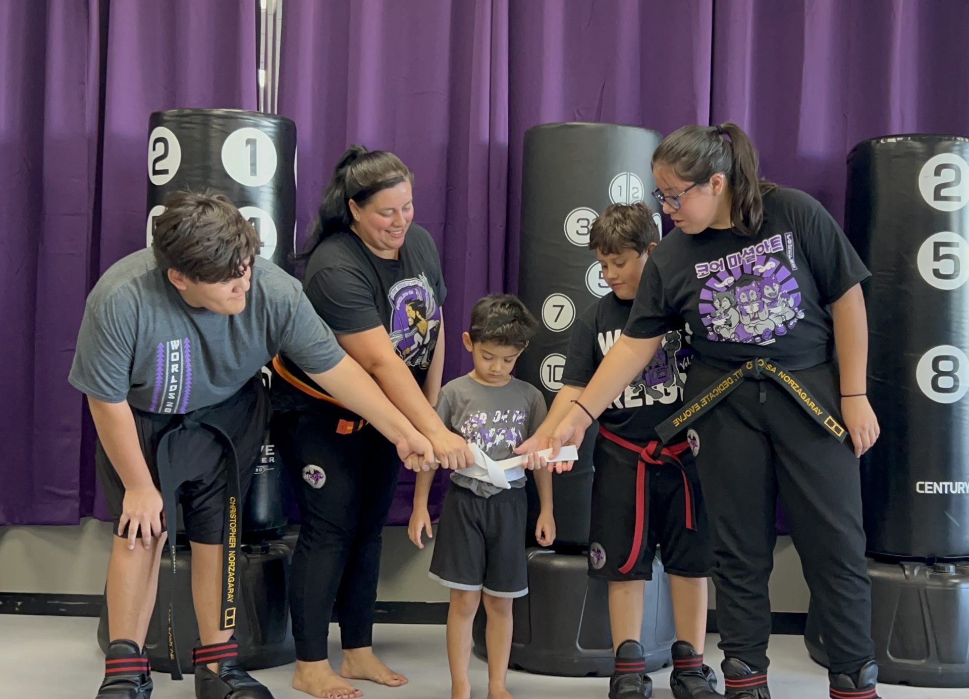 Parents and coaches helping little students at CORE Fitness & Martial Arts in Henderson