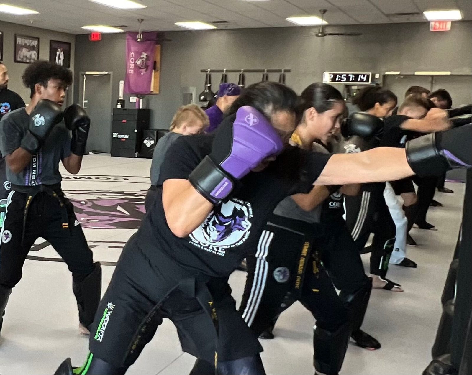 Warrior students in gloves drilling punches together at CORE Fitness & Martial Arts in Henderson