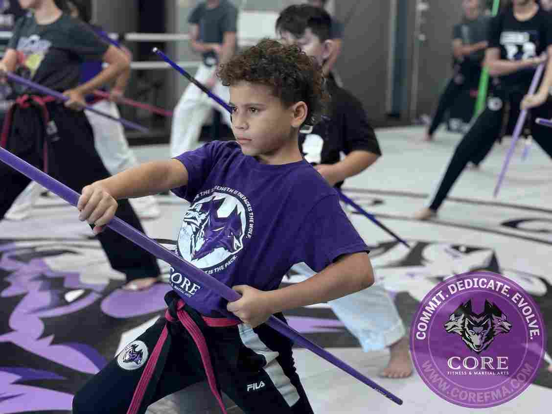 children getting martial arts achievements