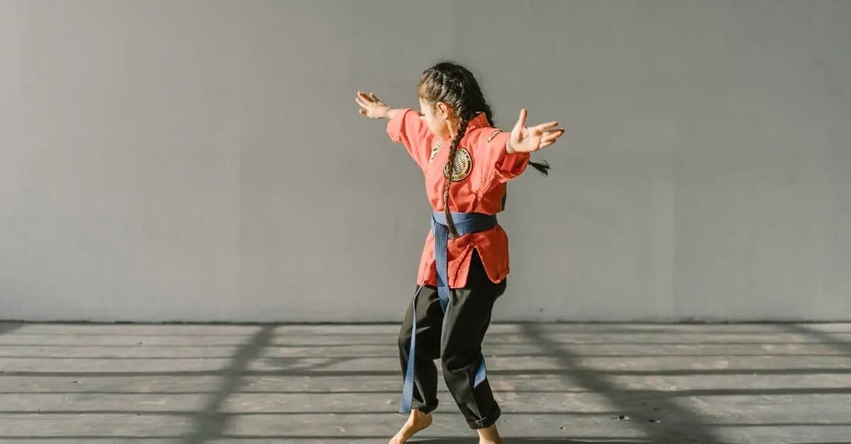 Student engaged in a high-energy training session focused on mastering Taekwondo basics for beginners forms